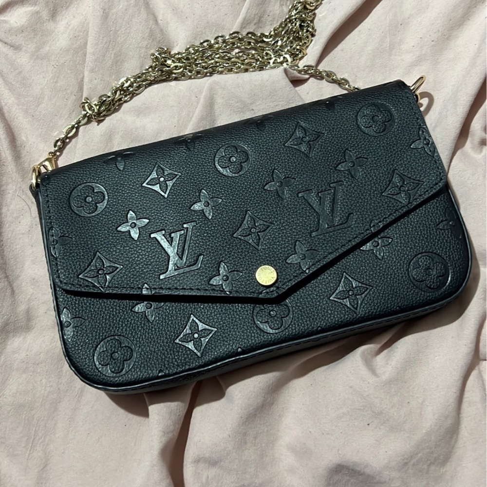 Black handbag. Brand new. With box and bag it comes in.